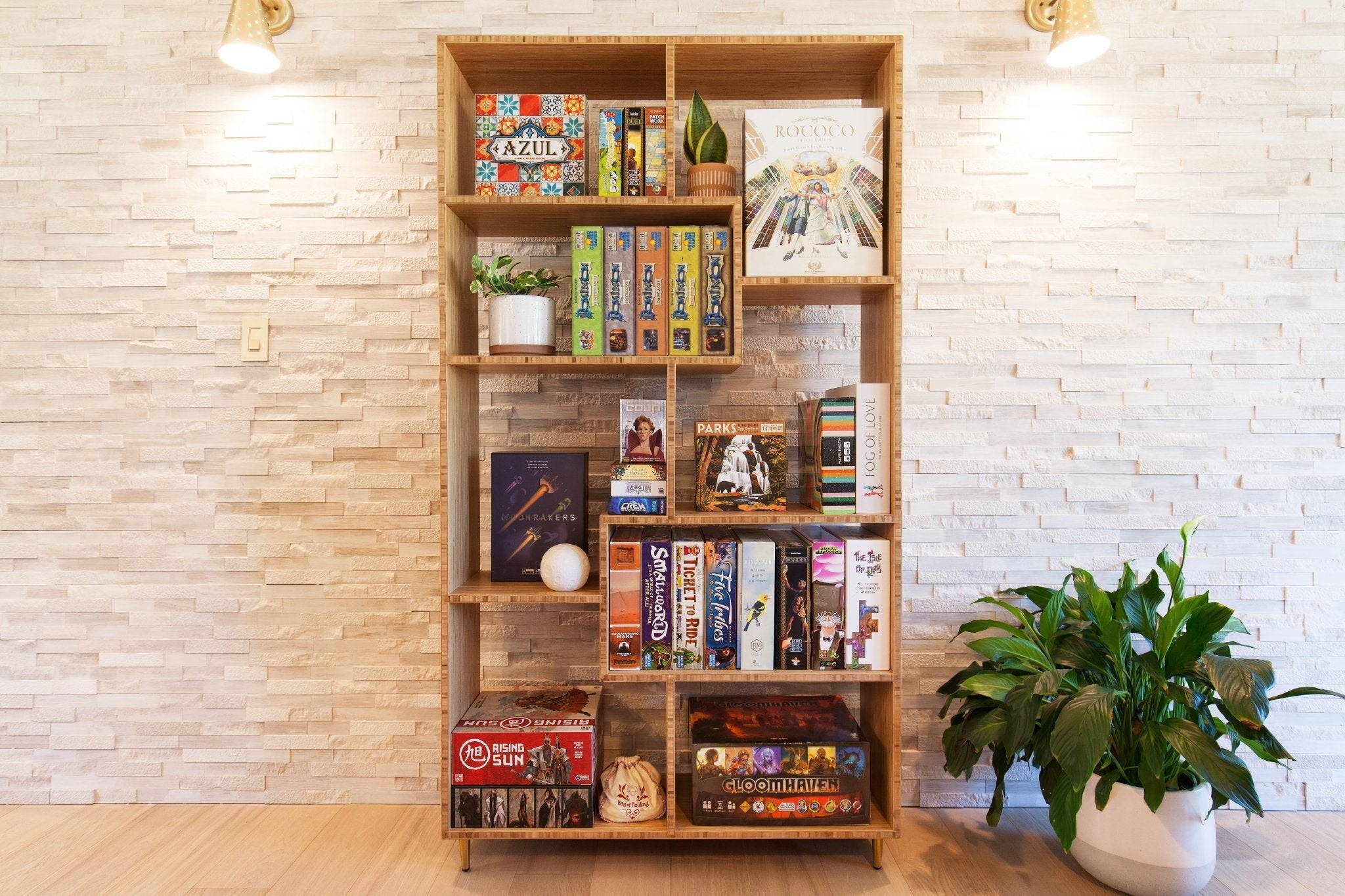 Eolean Racks A wooden Eolian display shelf filled with various items like books and ...
